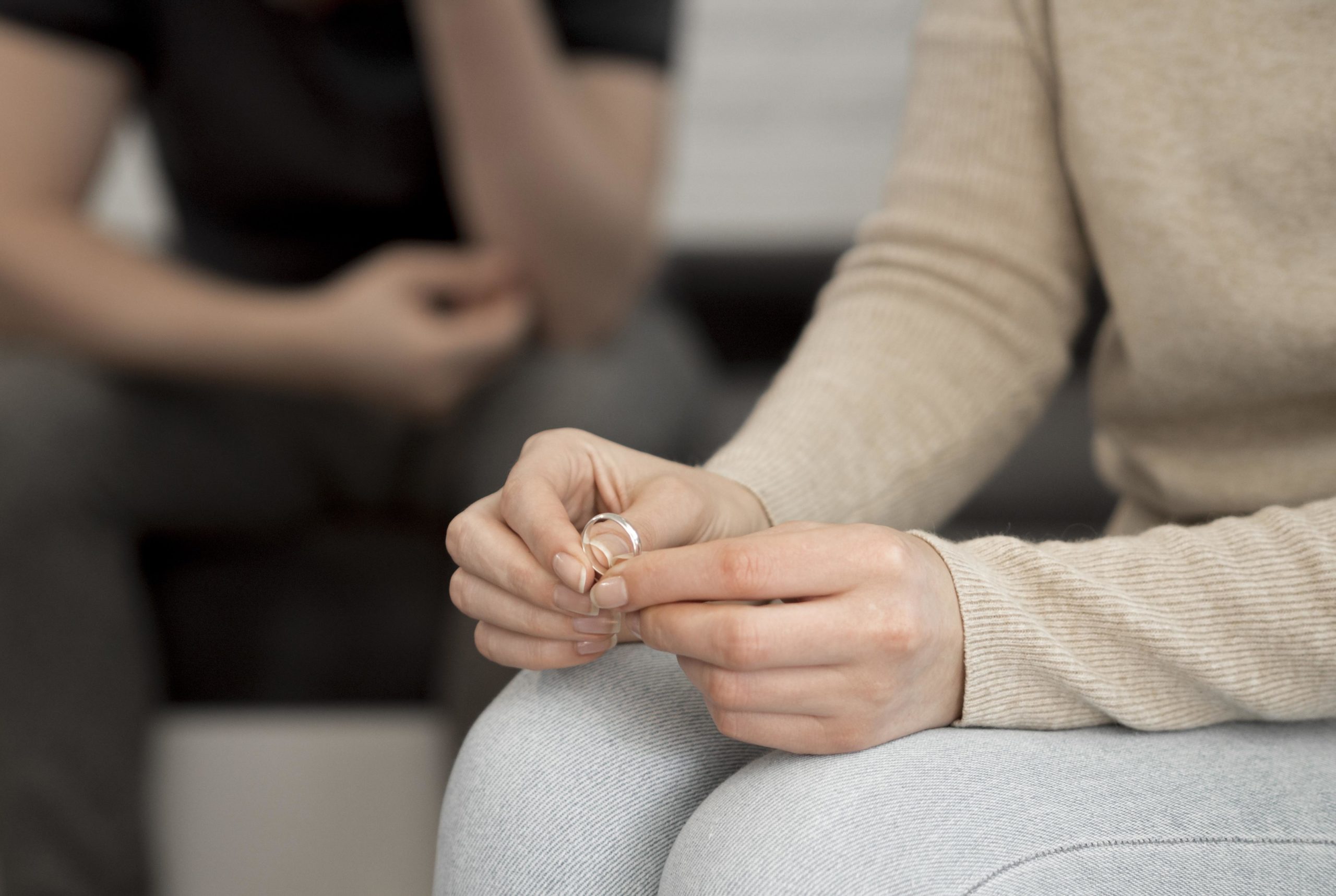 women holding ring and starting divorce process